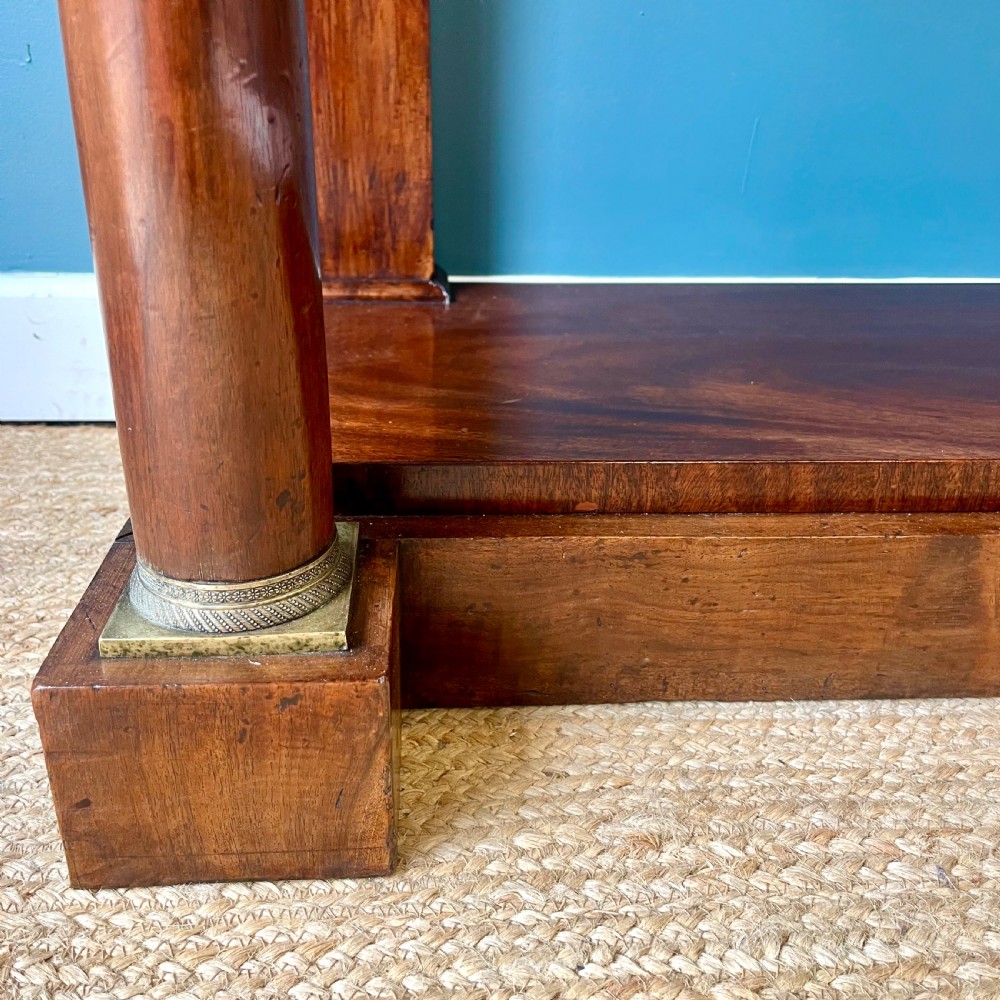 A 19th-century French walnut console table featuring a grey variegated marble top, single frieze drawer, and column legs on a plinth base. View IX