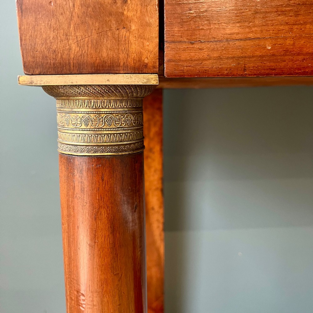 A 19th-century French walnut console table featuring a grey variegated marble top, single frieze drawer, and column legs on a plinth base. View XII