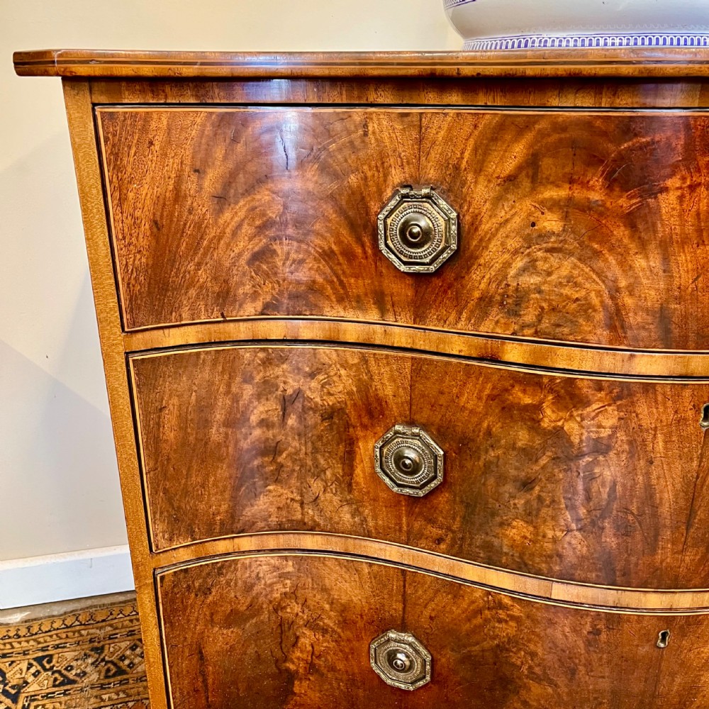 Georgian serpentine chest of drawers View II