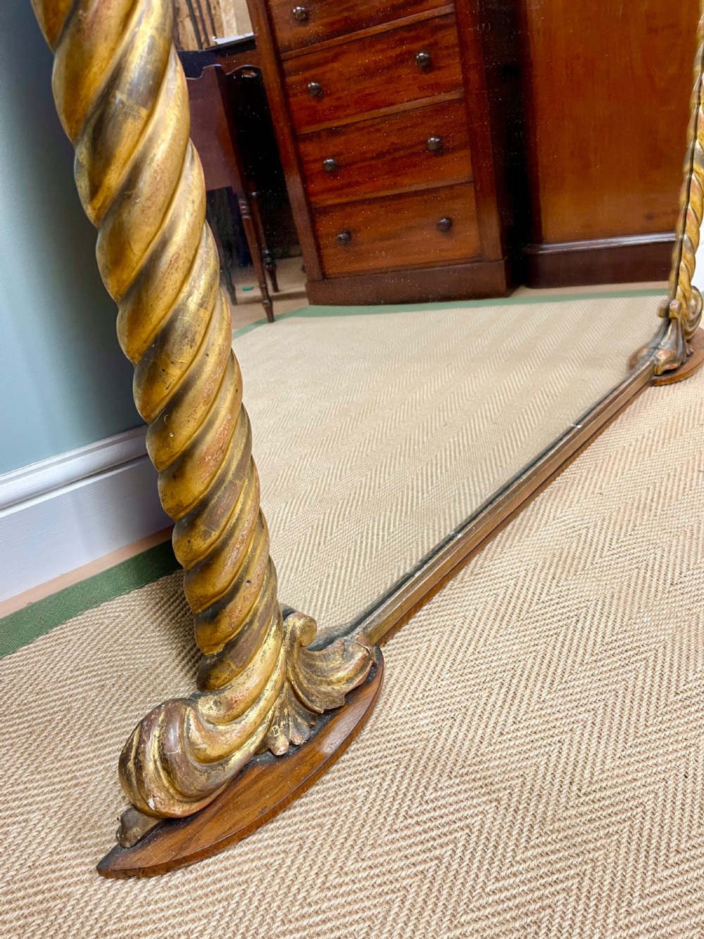 A 19th-century arched overmantel mirror with a gold gilded rope-twist frame and scrolled corner supports. View III
