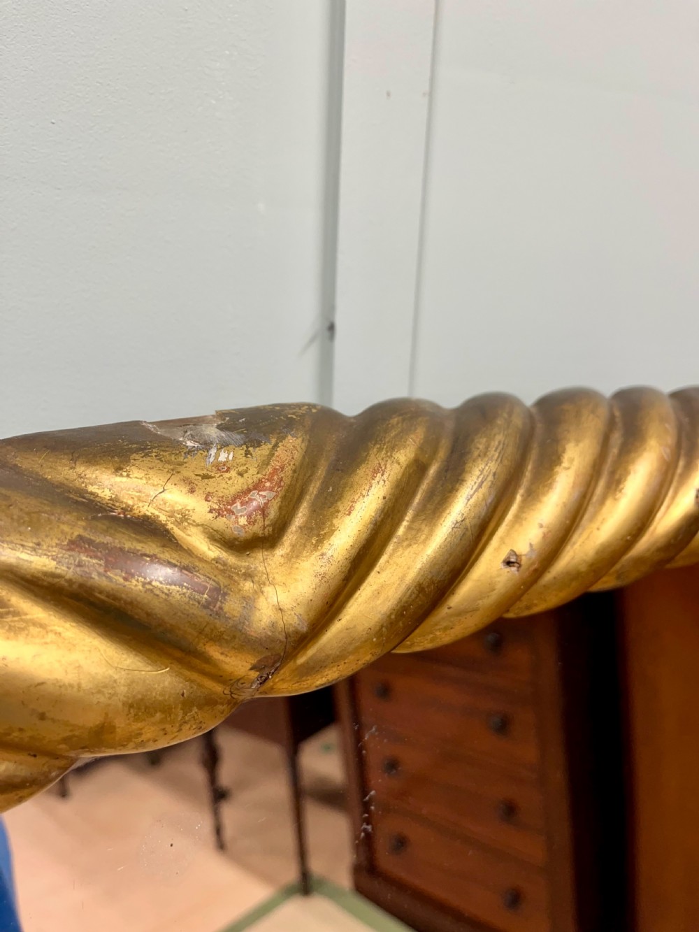 A 19th-century arched overmantel mirror with a gold gilded rope-twist frame and scrolled corner supports. View IV