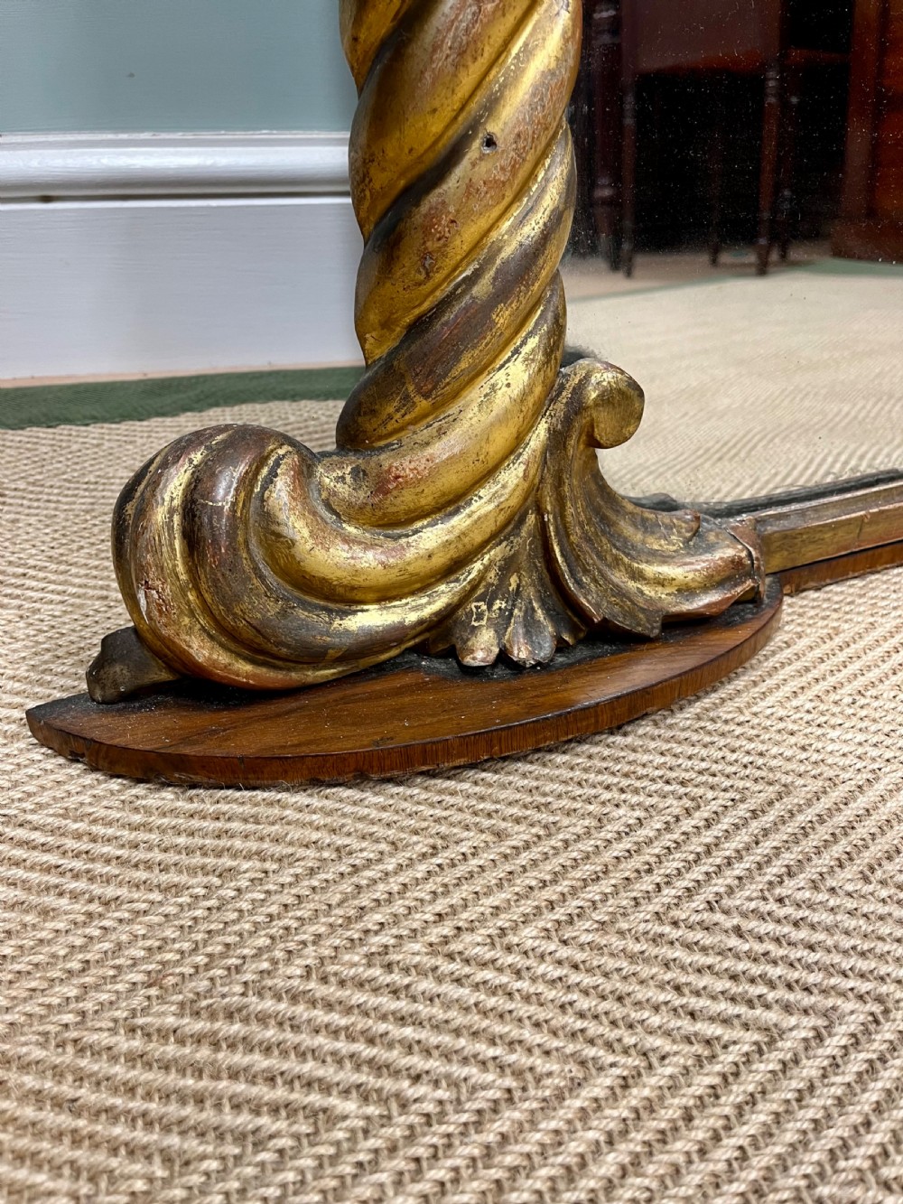 A 19th-century arched overmantel mirror with a gold gilded rope-twist frame and scrolled corner supports. View VI