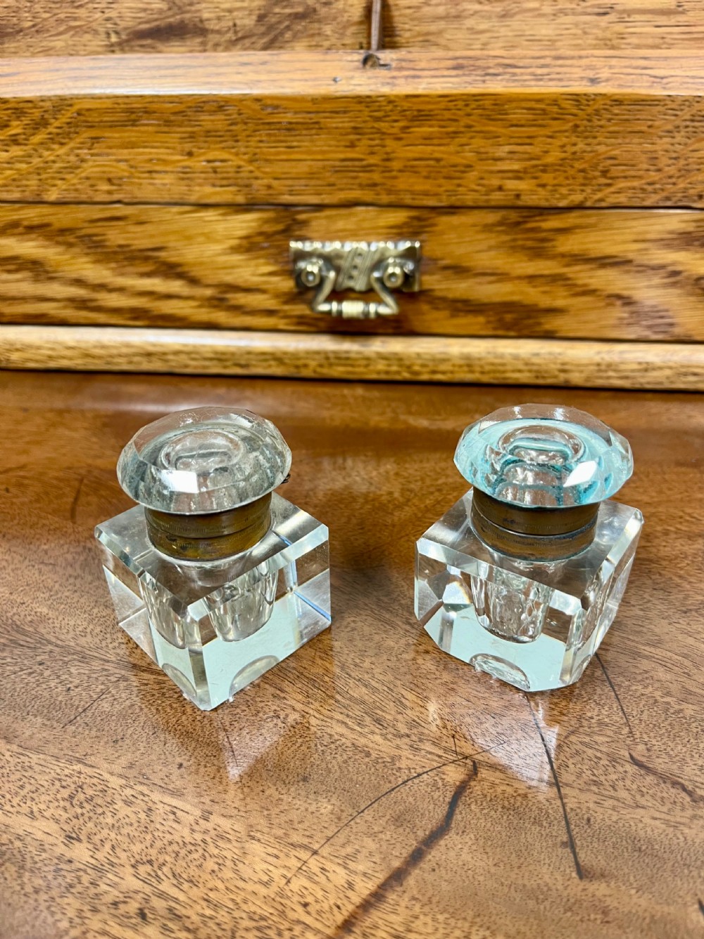 A Victorian oak stationery cabinet with open doors showing stepped letter compartments, a built-in calendar mechanism, inkwell slots, and a lower drawer. View VII