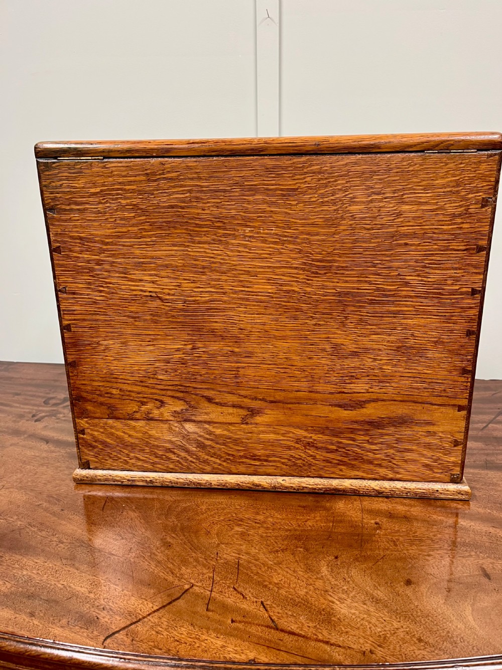 A Victorian oak stationery cabinet with open doors showing stepped letter compartments, a built-in calendar mechanism, inkwell slots, and a lower drawer. View XII