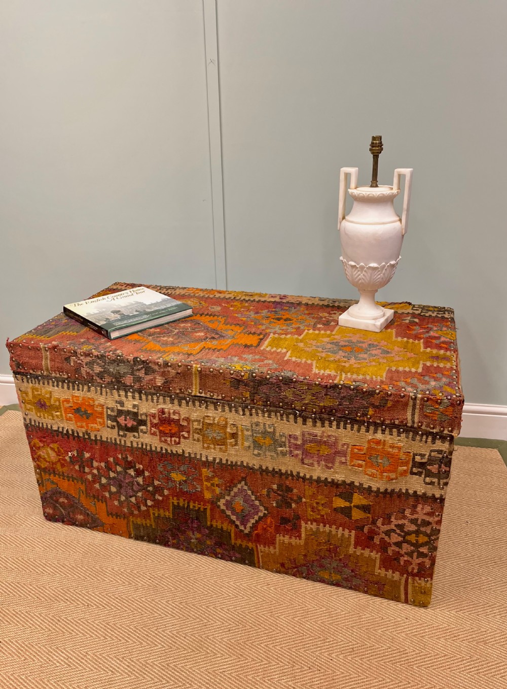 19th century kilim covered pine trunk View II
