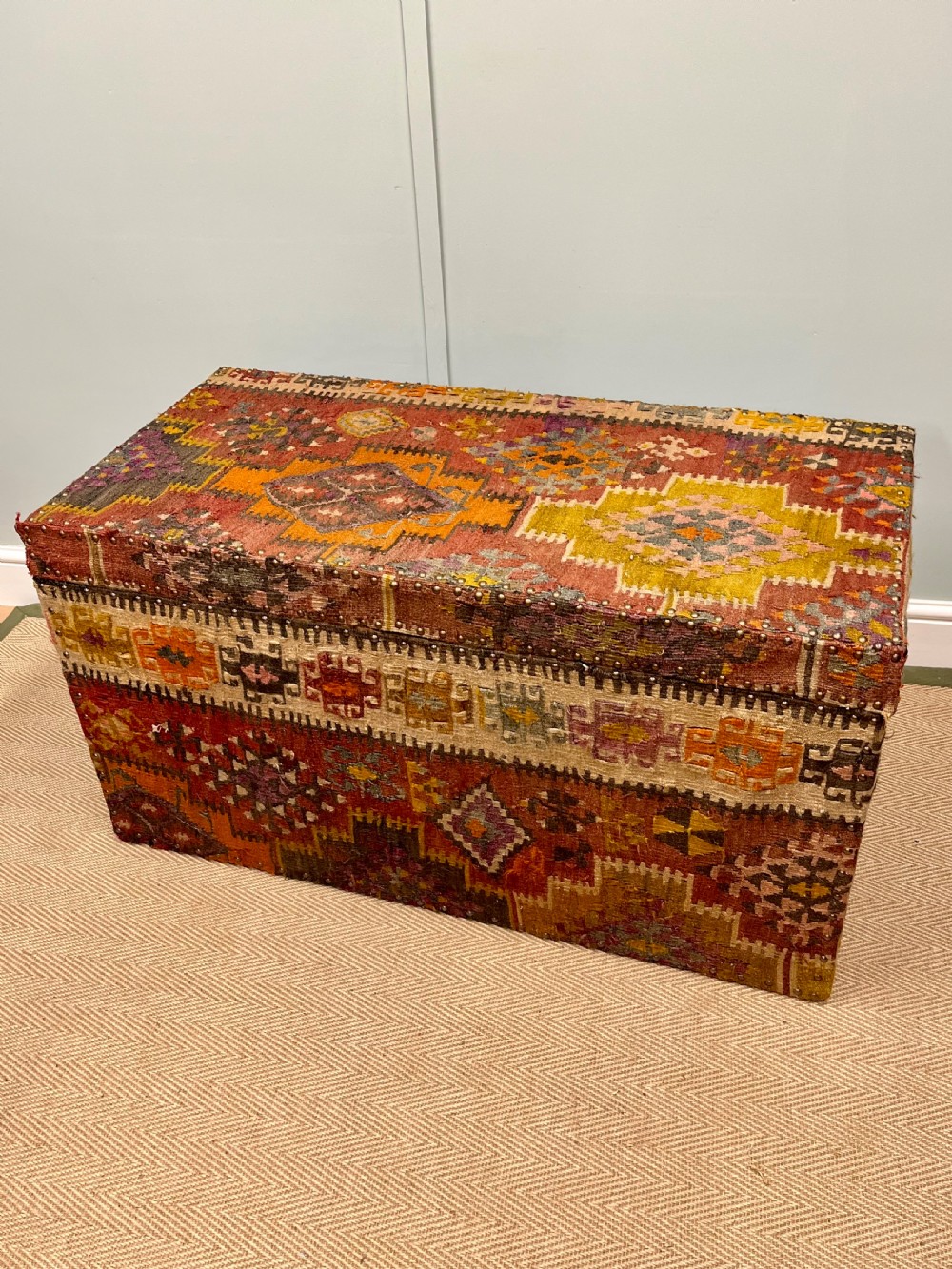 19th century kilim covered pine trunk