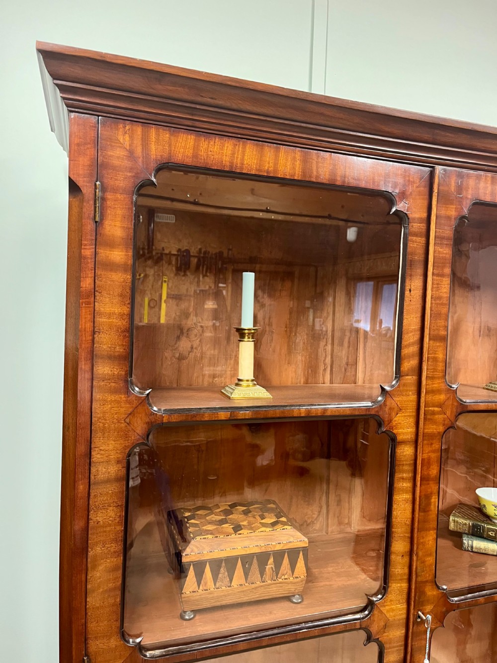 A tall 19th-century mahogany glazed bookcase featuring two double doors with multi-paned glass windows and a moulded top cornice. View III