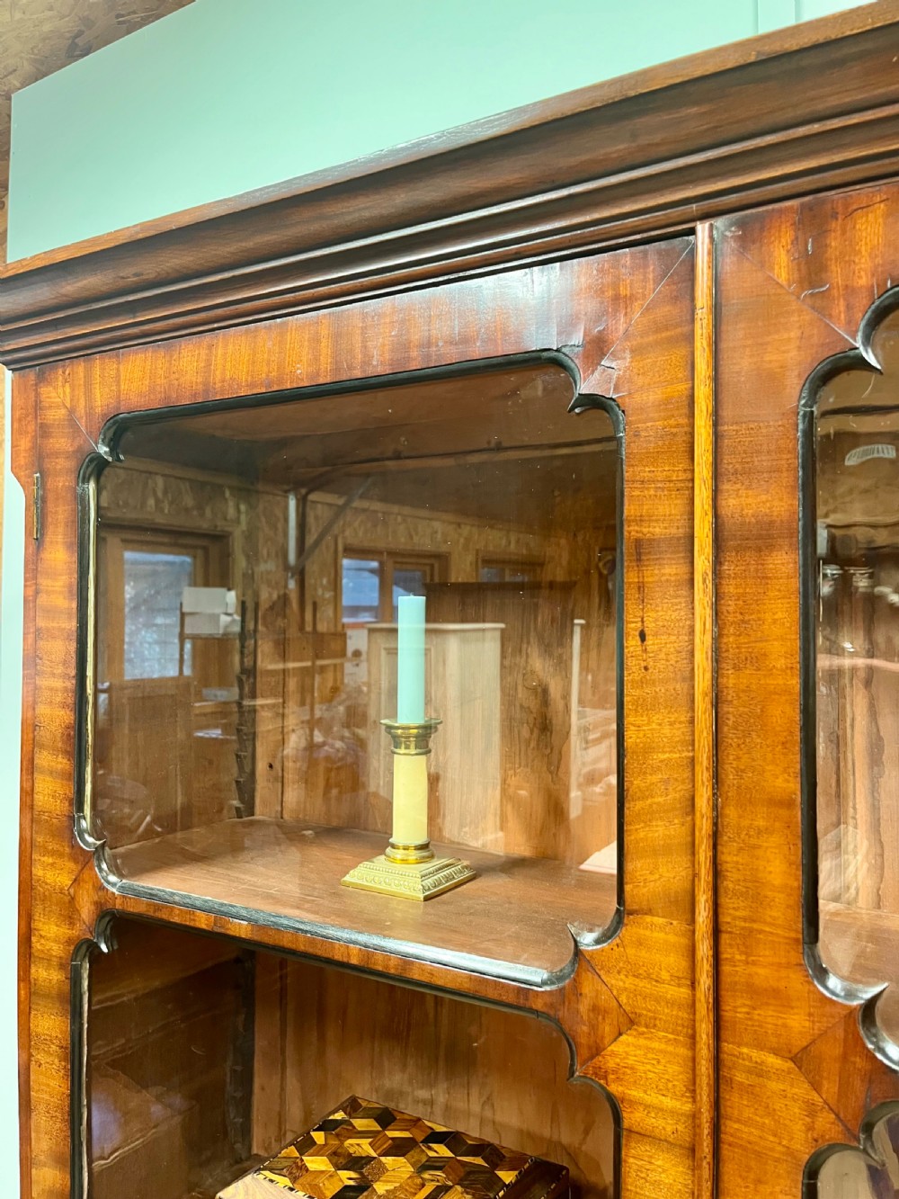 A tall 19th-century mahogany glazed bookcase featuring two double doors with multi-paned glass windows and a moulded top cornice. View VI