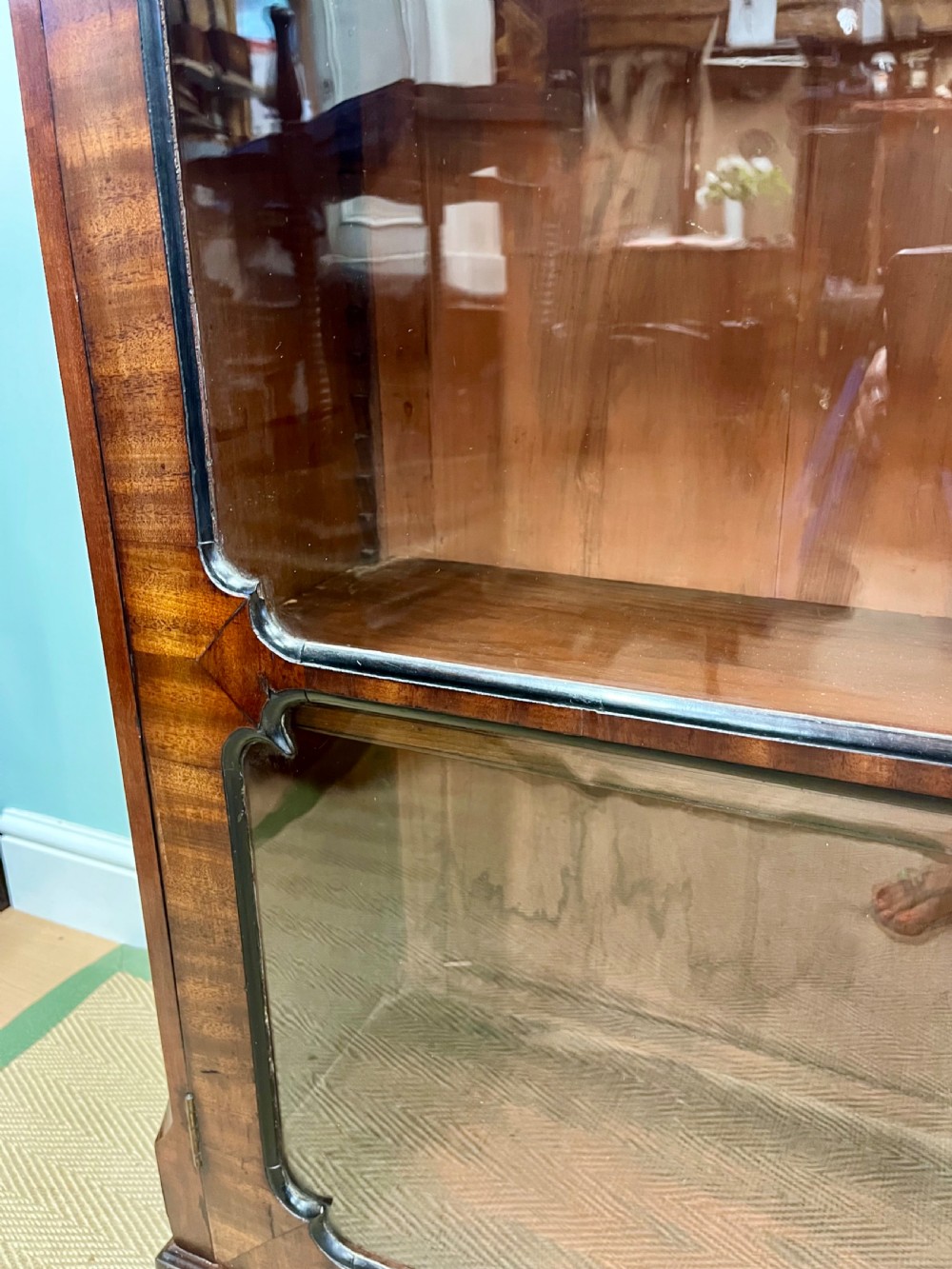 A tall 19th-century mahogany glazed bookcase featuring two double doors with multi-paned glass windows and a moulded top cornice. View IX