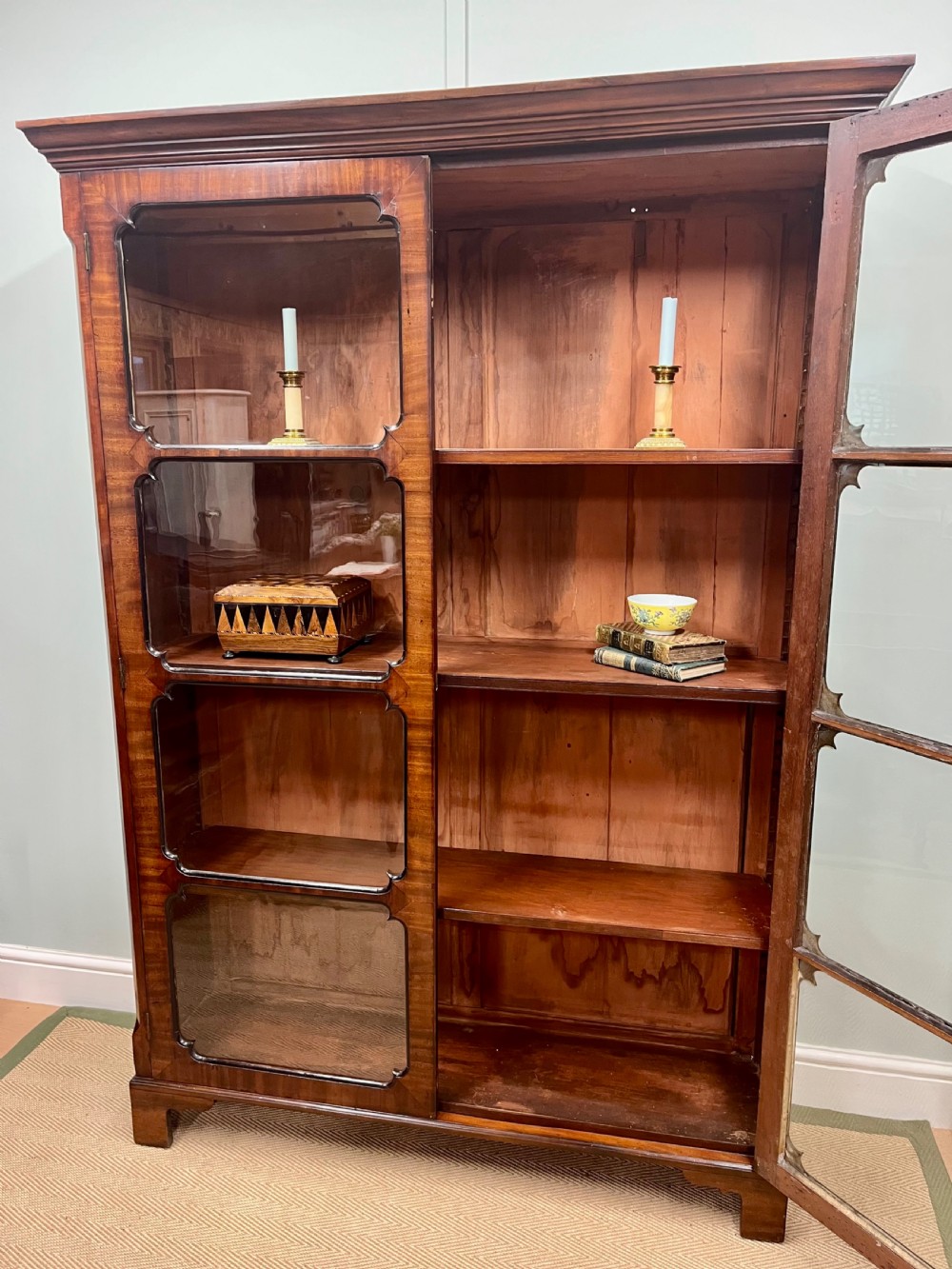 A tall 19th-century mahogany glazed bookcase featuring two double doors with multi-paned glass windows and a moulded top cornice. View XII