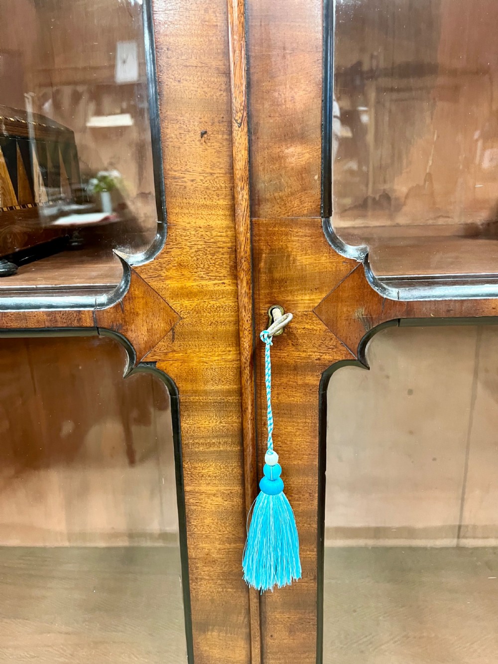 A tall 19th-century mahogany glazed bookcase featuring two double doors with multi-paned glass windows and a moulded top cornice. View XIII
