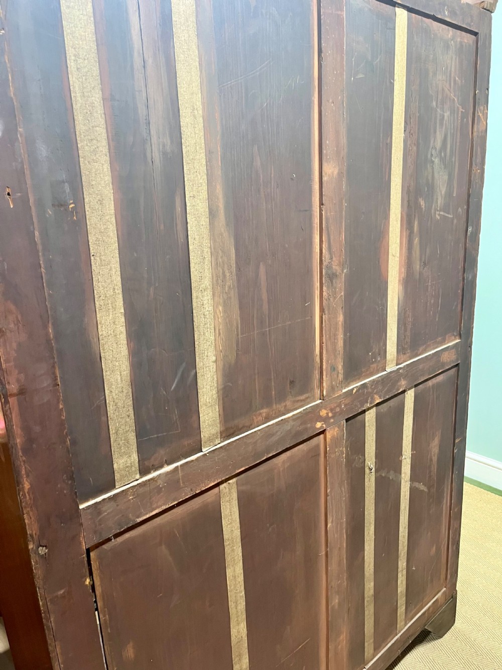 A tall 19th-century mahogany glazed bookcase featuring two double doors with multi-paned glass windows and a moulded top cornice. View XIV
