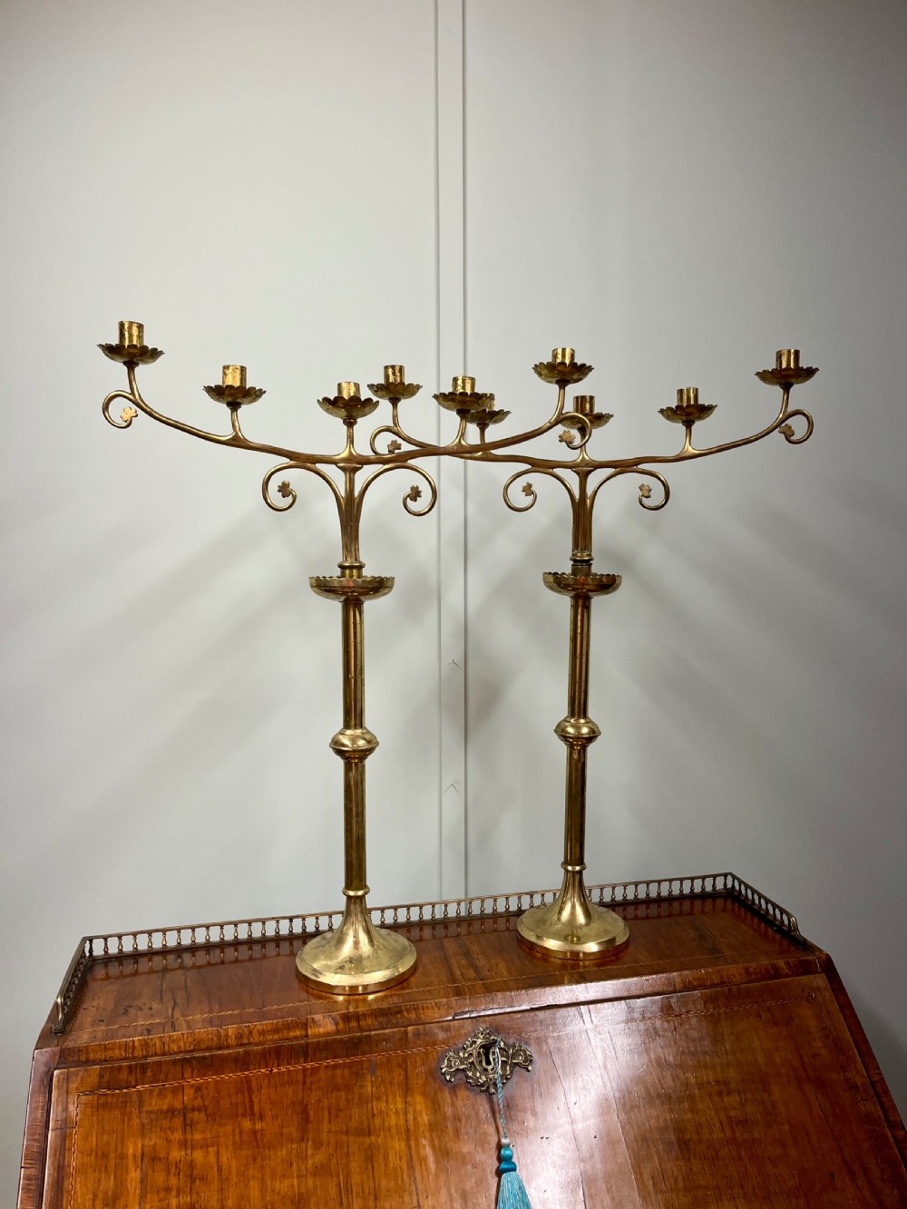 Pair of Gothic style brass candle sticks