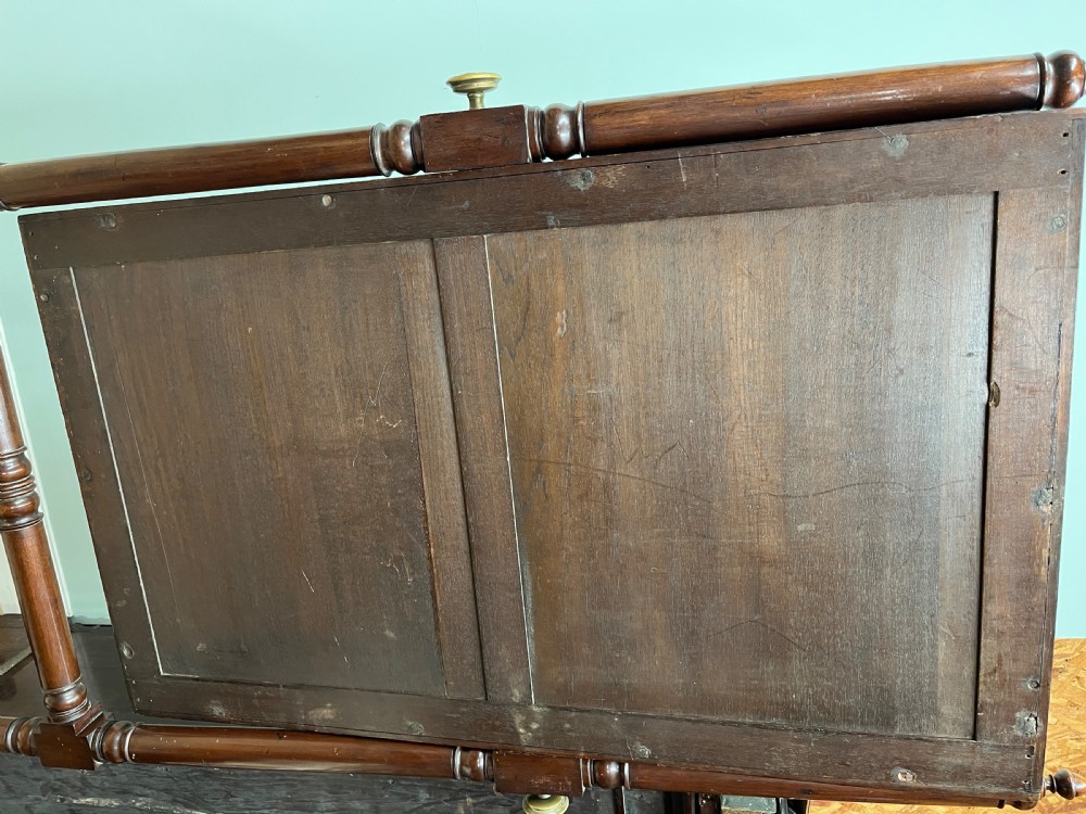 A 19th-century dark mahogany cheval mirror featuring bobbin-moulded edging, turned upright support columns with finials, brass adjusting knobs, and a trestle base with splayed legs. View VIII