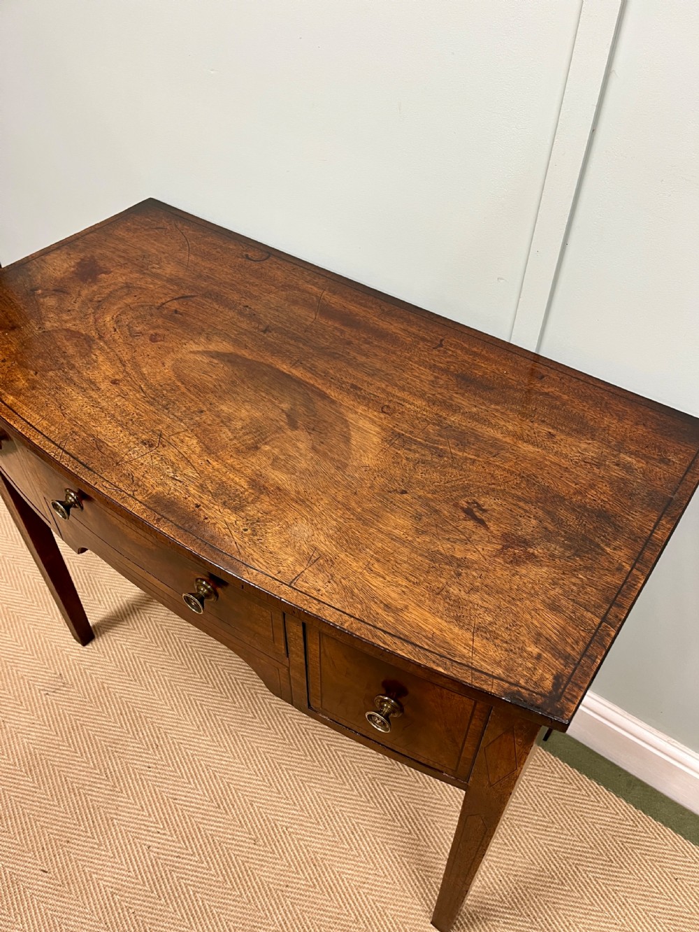 Georgian mahogany bow fronted table View X