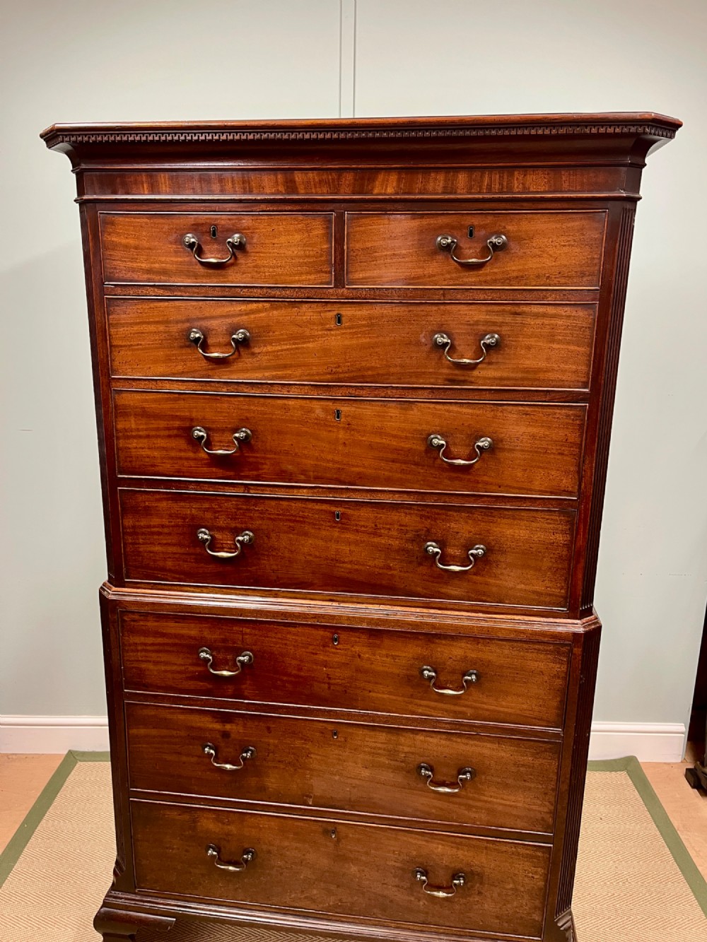 An 18th-century Georgian mahogany chest on chest featuring two short over six long graduated drawers with brass swan-neck handles and ogee bracket feet. View II