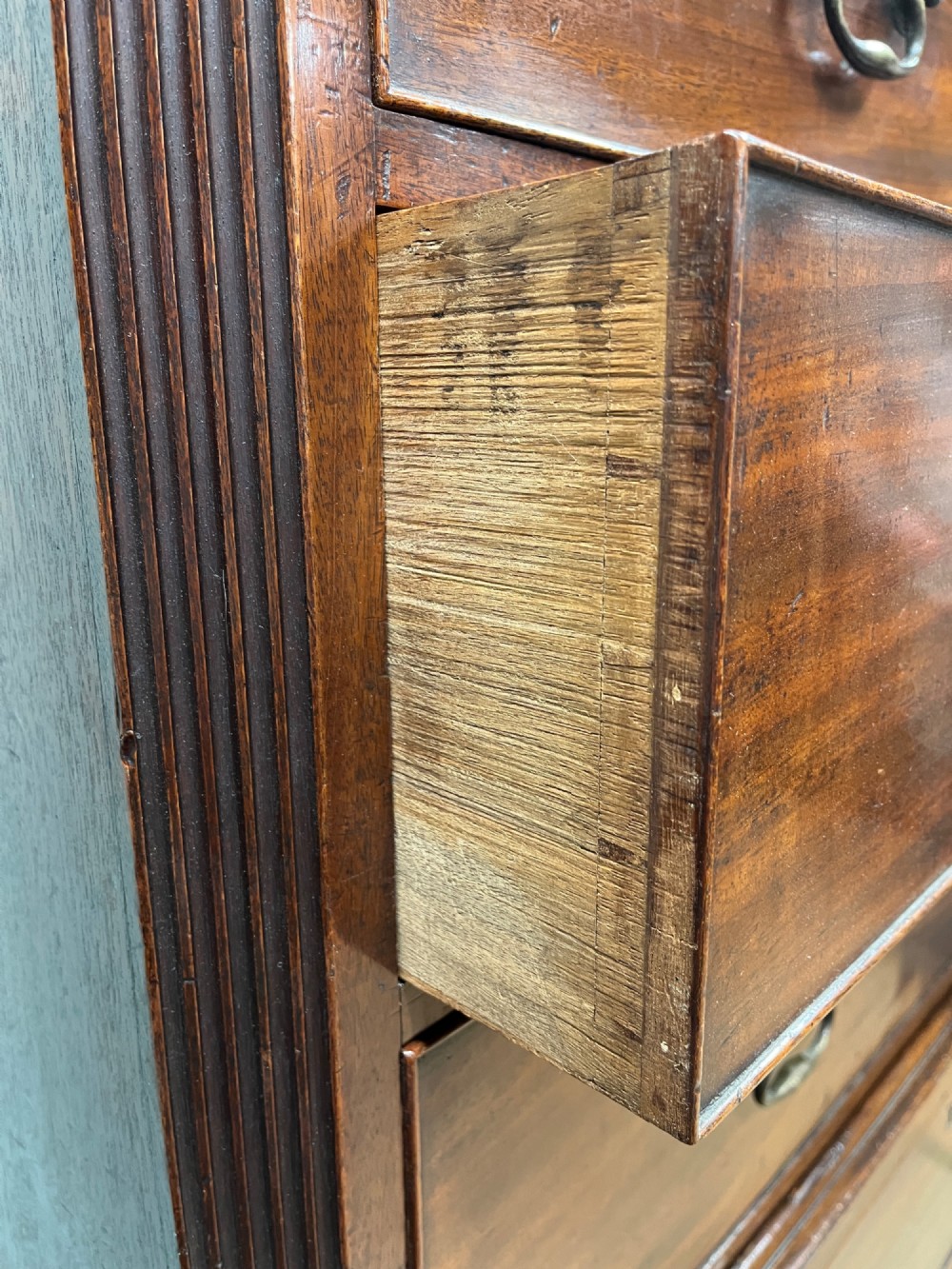 An 18th-century Georgian mahogany chest on chest featuring two short over six long graduated drawers with brass swan-neck handles and ogee bracket feet. View VIII