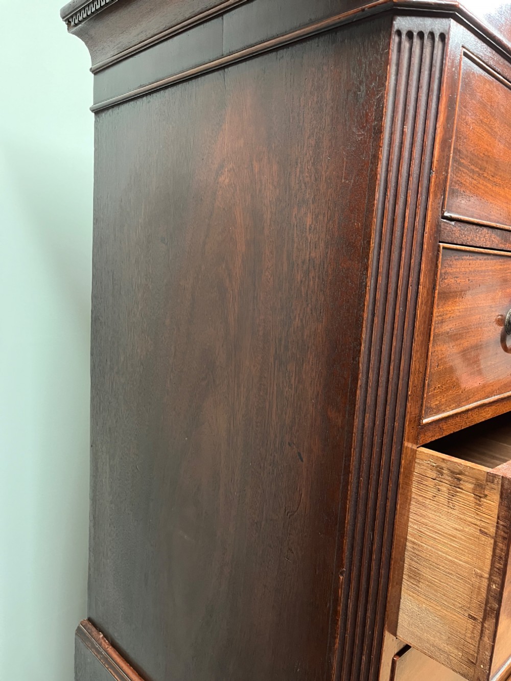 An 18th-century Georgian mahogany chest on chest featuring two short over six long graduated drawers with brass swan-neck handles and ogee bracket feet. View IX