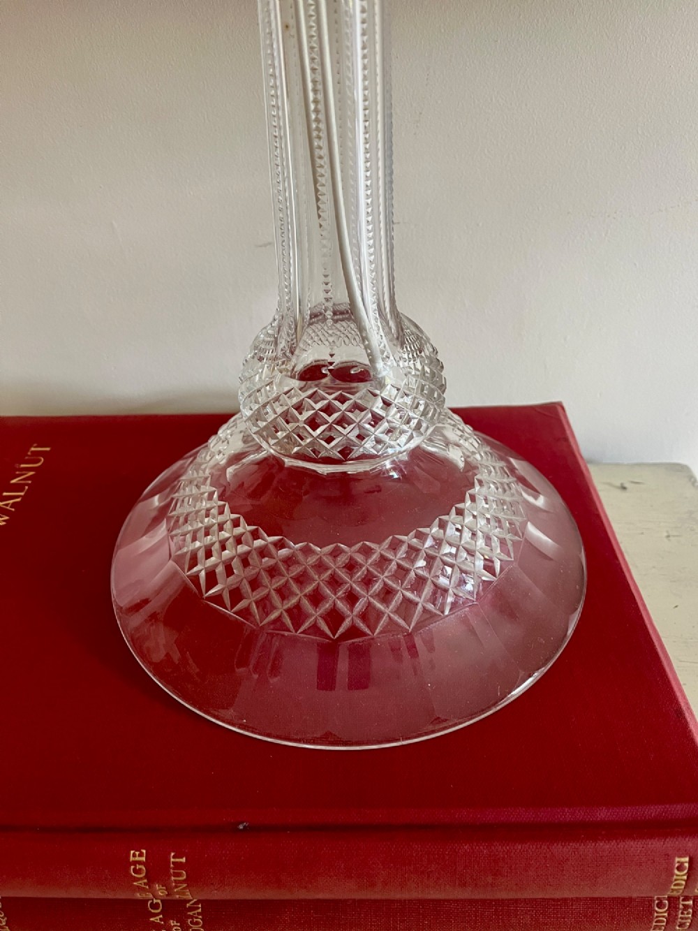 A clear cut crystal table lamp base featuring a fluted central column and a diamond-cut domed foot. View II