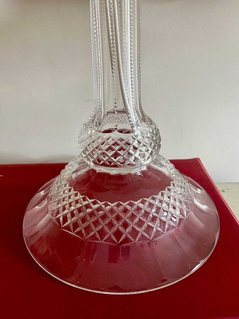 A clear cut crystal table lamp base featuring a fluted central column and a diamond-cut domed foot. View IV