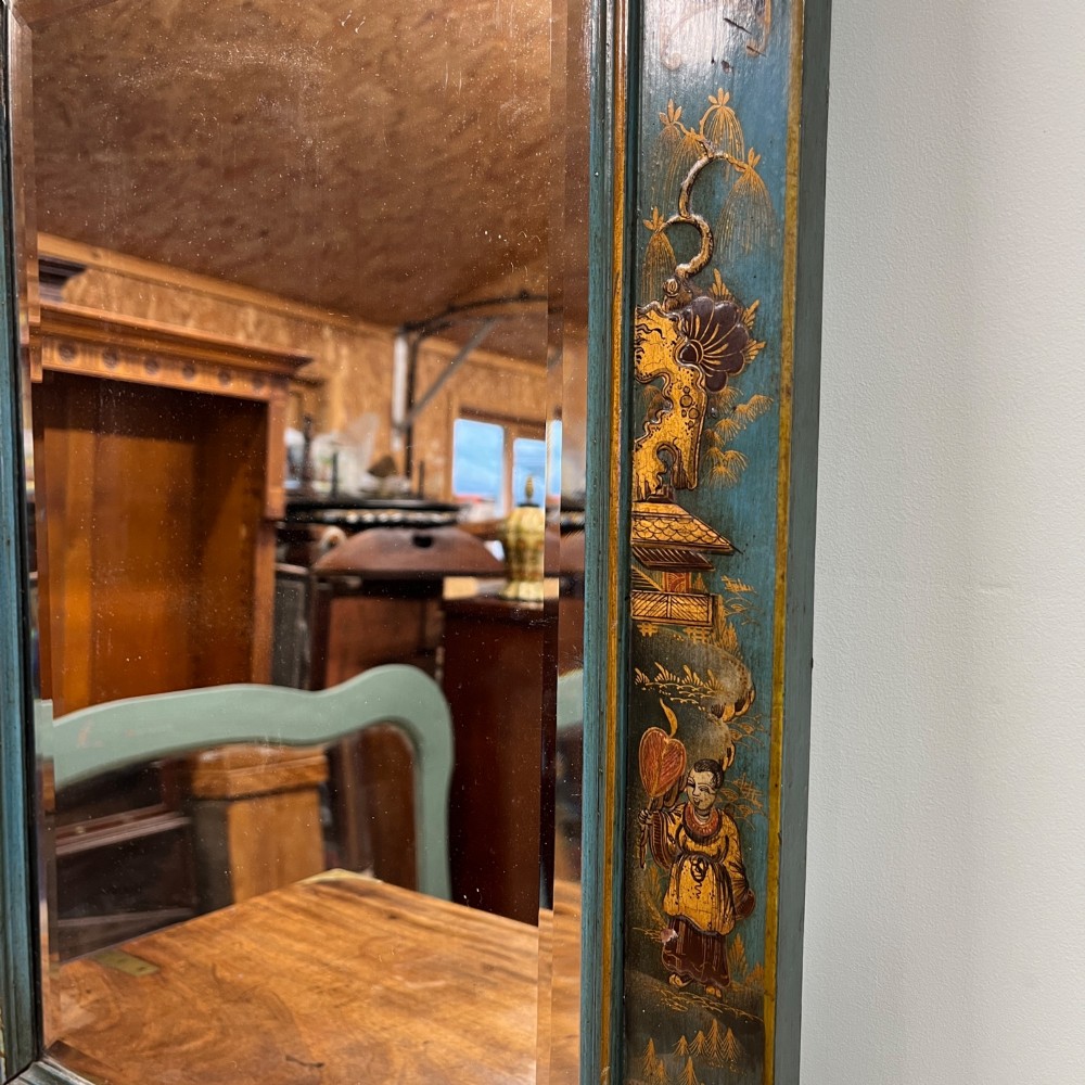 An Edwardian Chinoiserie wall mirror featuring a teal blue and gilt painted wooden frame with hand-painted Asian landscapes and a carved openwork cresting. View VII