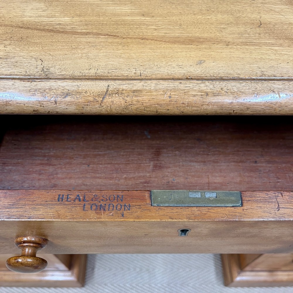 A 19th-century satin birch twin-pedestal desk featuring nine drawers with turned wooden knobs and a low gallery back. View II