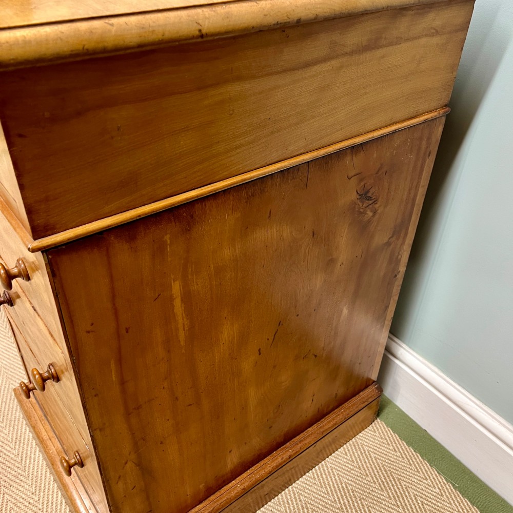 A 19th-century satin birch twin-pedestal desk featuring nine drawers with turned wooden knobs and a low gallery back. View VIII
