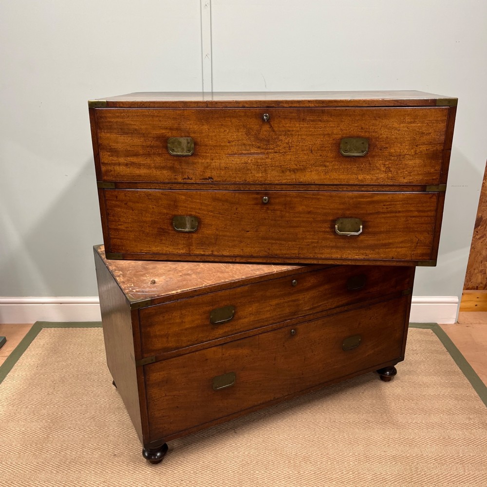 A 19th-century mahogany military campaign secretaire chest featuring four drawers with recessed brass handles and brass corner straps, resting on turned feet. View XIII