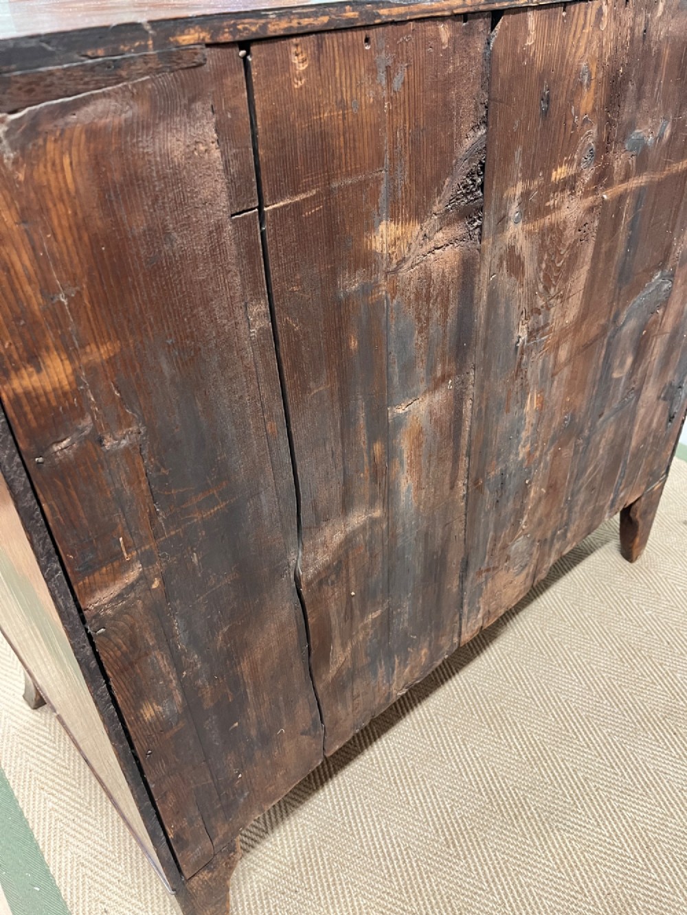 An antique Regency bow-fronted mahogany chest of drawers with four graduated drawers, brass ring handles, and splayed bracket feet. View XI