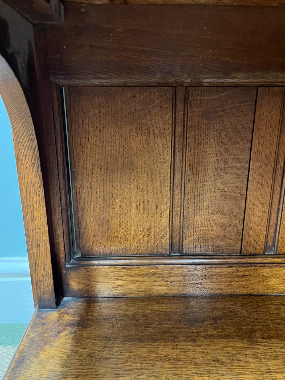 A 19th-century oak dresser featuring a three-tiered open shelf rack above two drawers with brass swan-neck handles and an open pot board base on turned legs. View X