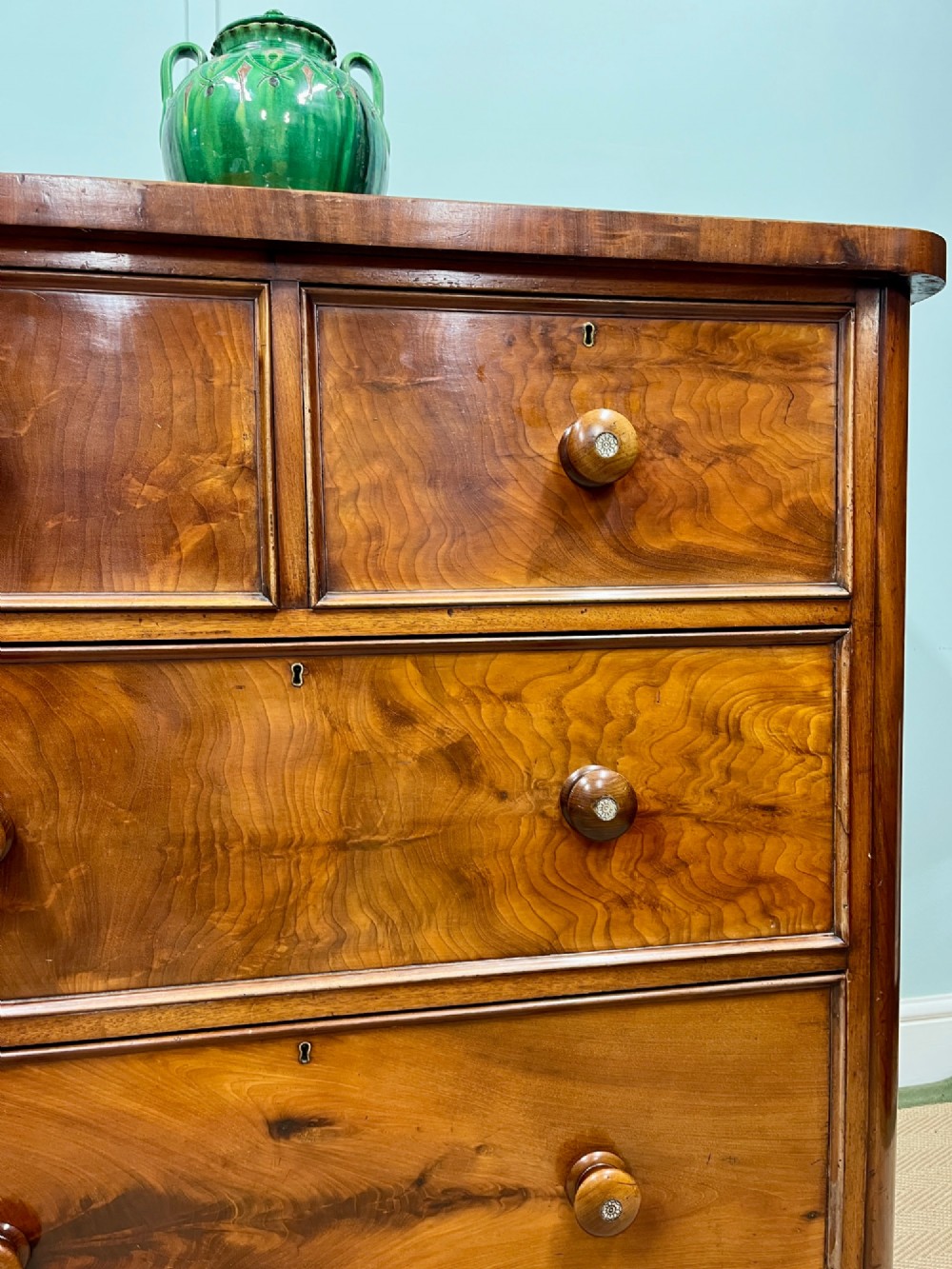 A 19th-century mahogany chest of drawers featuring two short upper drawers above two long lower drawers, set on a solid plinth base. View V