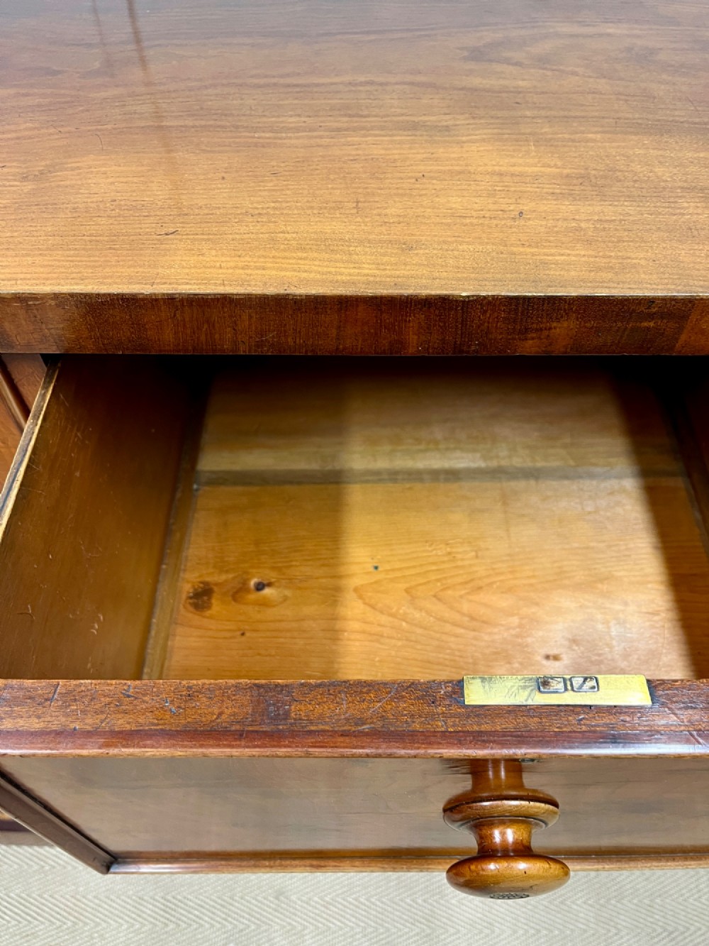 A 19th-century mahogany chest of drawers featuring two short upper drawers above two long lower drawers, set on a solid plinth base. View X