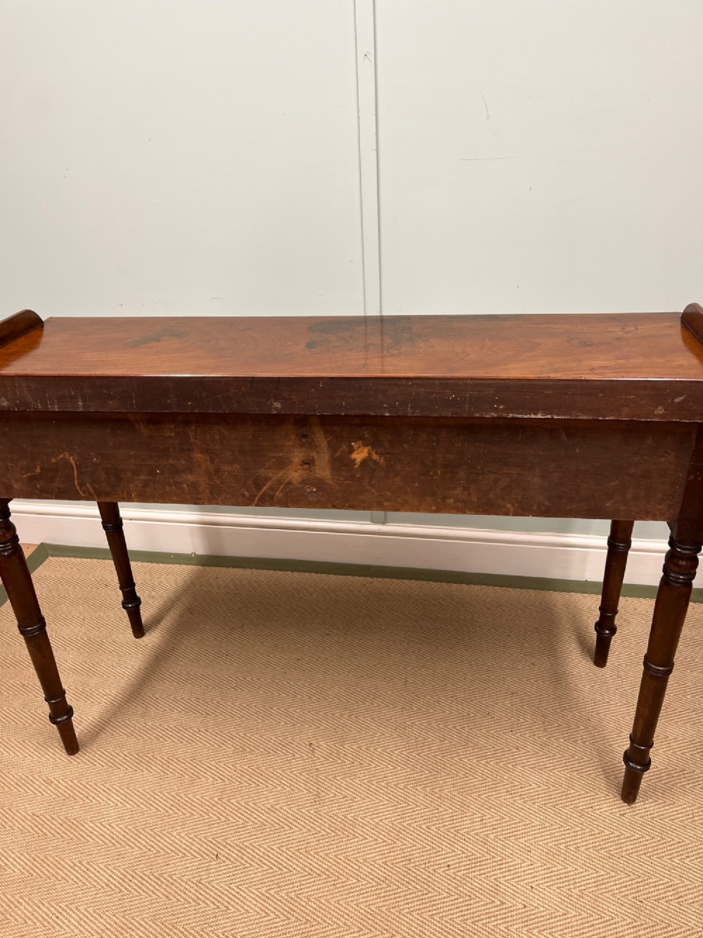 A 19th-century mahogany hall table with two frieze drawers, turned legs, and a raised gallery edge along the top. View IX
