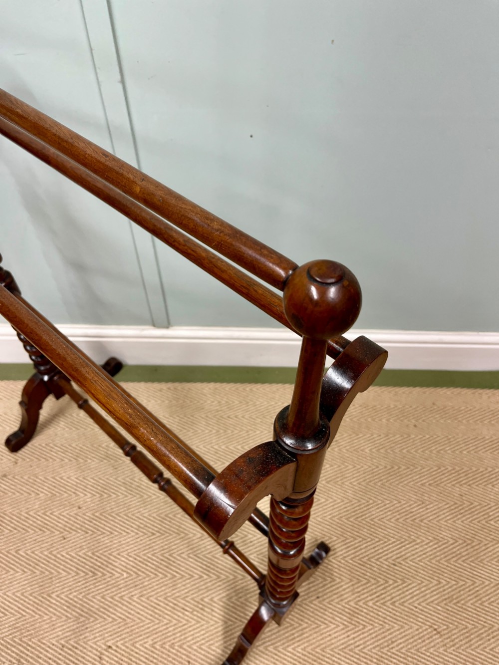 A 19th-century mahogany freestanding towel rail featuring barley twist uprights, turned rails, and carved trestle feet. View IV