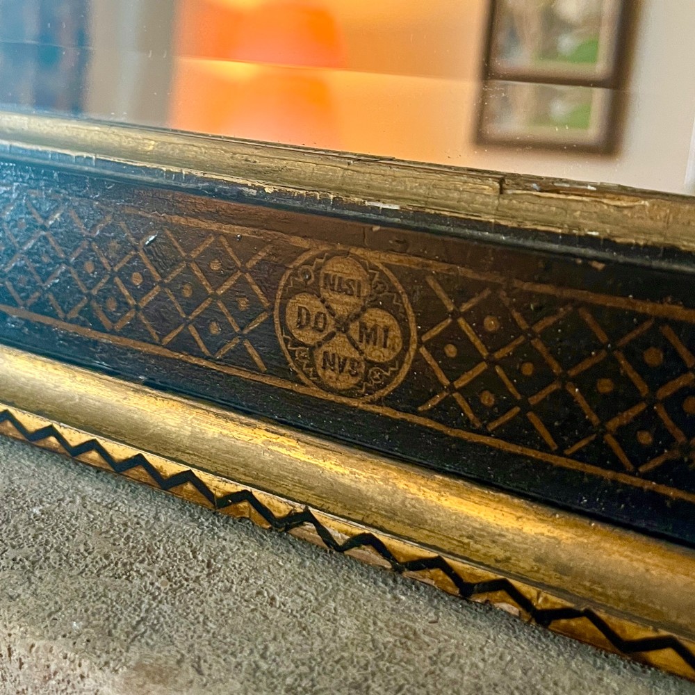 A large nineteenth-century rectangular wall mirror featuring a dark painted frame embellished with geometric motifs and a gilded outer border. View II