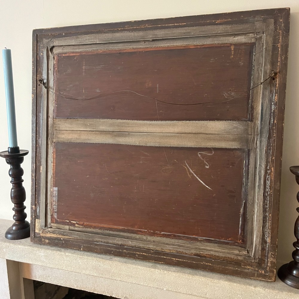 A large nineteenth-century rectangular wall mirror featuring a dark painted frame embellished with geometric motifs and a gilded outer border. View VI