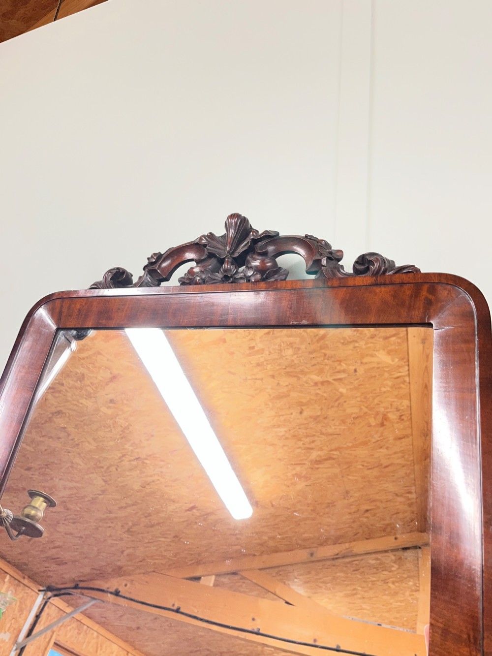 A 19th-century mahogany swing toilet mirror featuring carved support columns, two attached brass candle sconces, and a serpentine plinth base. View VIII