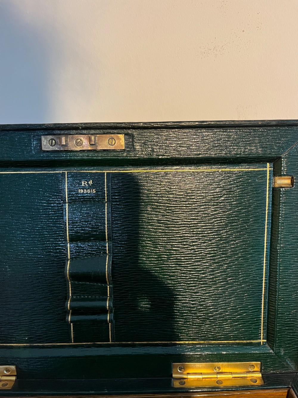 An open nineteenth-century dark green leather stationery box featuring brass fittings, interior memo panels, and compartmentalised sections. View IV