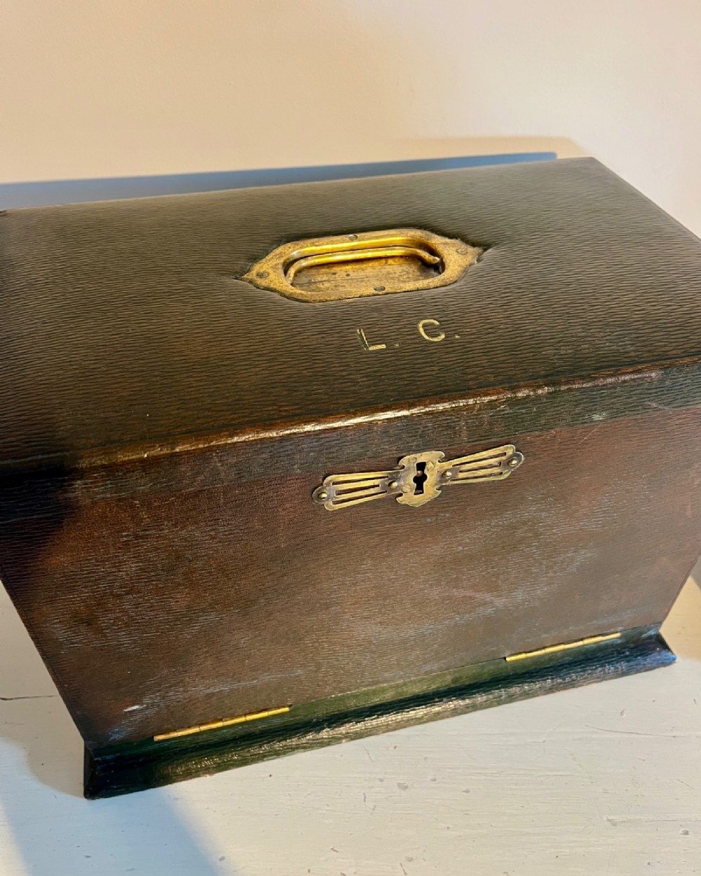 An open nineteenth-century dark green leather stationery box featuring brass fittings, interior memo panels, and compartmentalised sections. View VII
