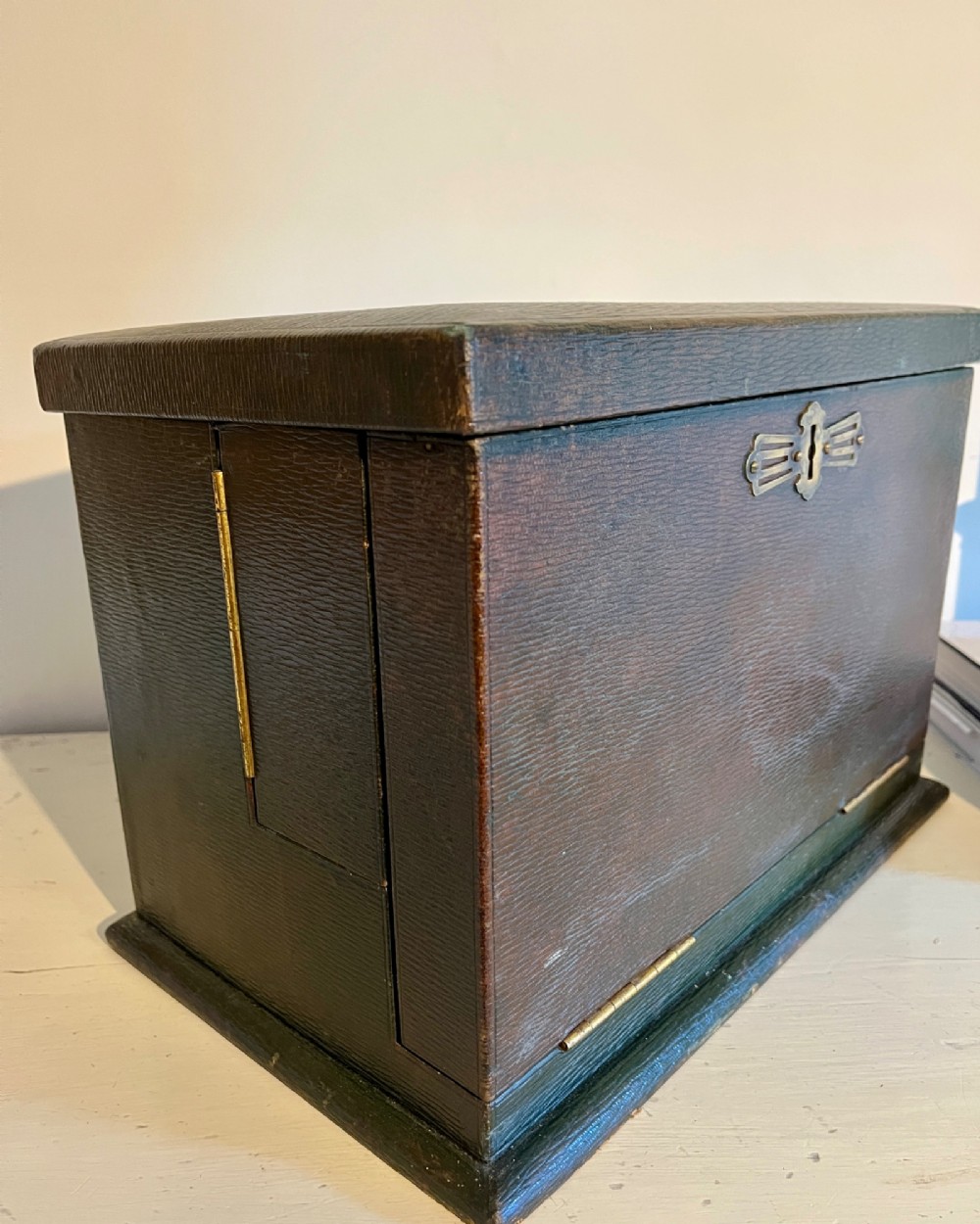 An open nineteenth-century dark green leather stationery box featuring brass fittings, interior memo panels, and compartmentalised sections. View XI