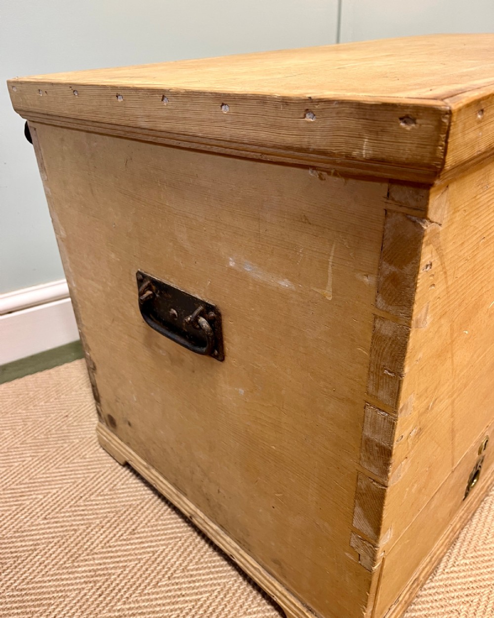 A 19th-century natural pine mule chest featuring a hinged top lid and two bottom drawers fitted with brass keyhole escutcheons. View VII