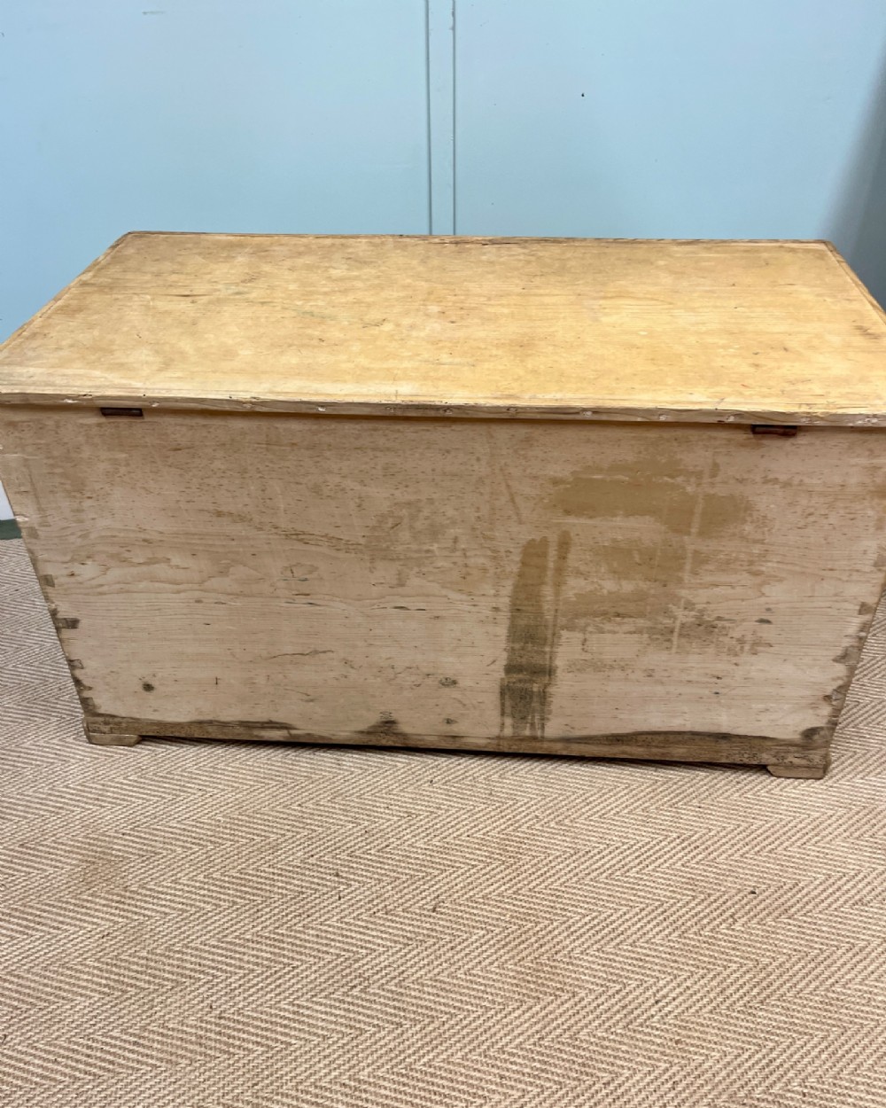 A 19th-century natural pine mule chest featuring a hinged top lid and two bottom drawers fitted with brass keyhole escutcheons. View VIII