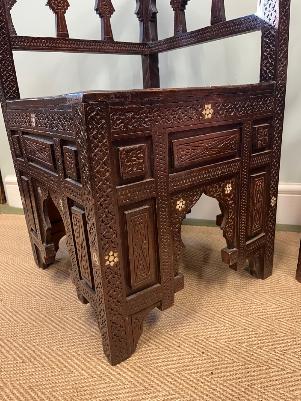 A pair of dark wood early 20th-century Moorish corner tables featuring geometric bone inlay and carved mashrabiya arch galleries. View III