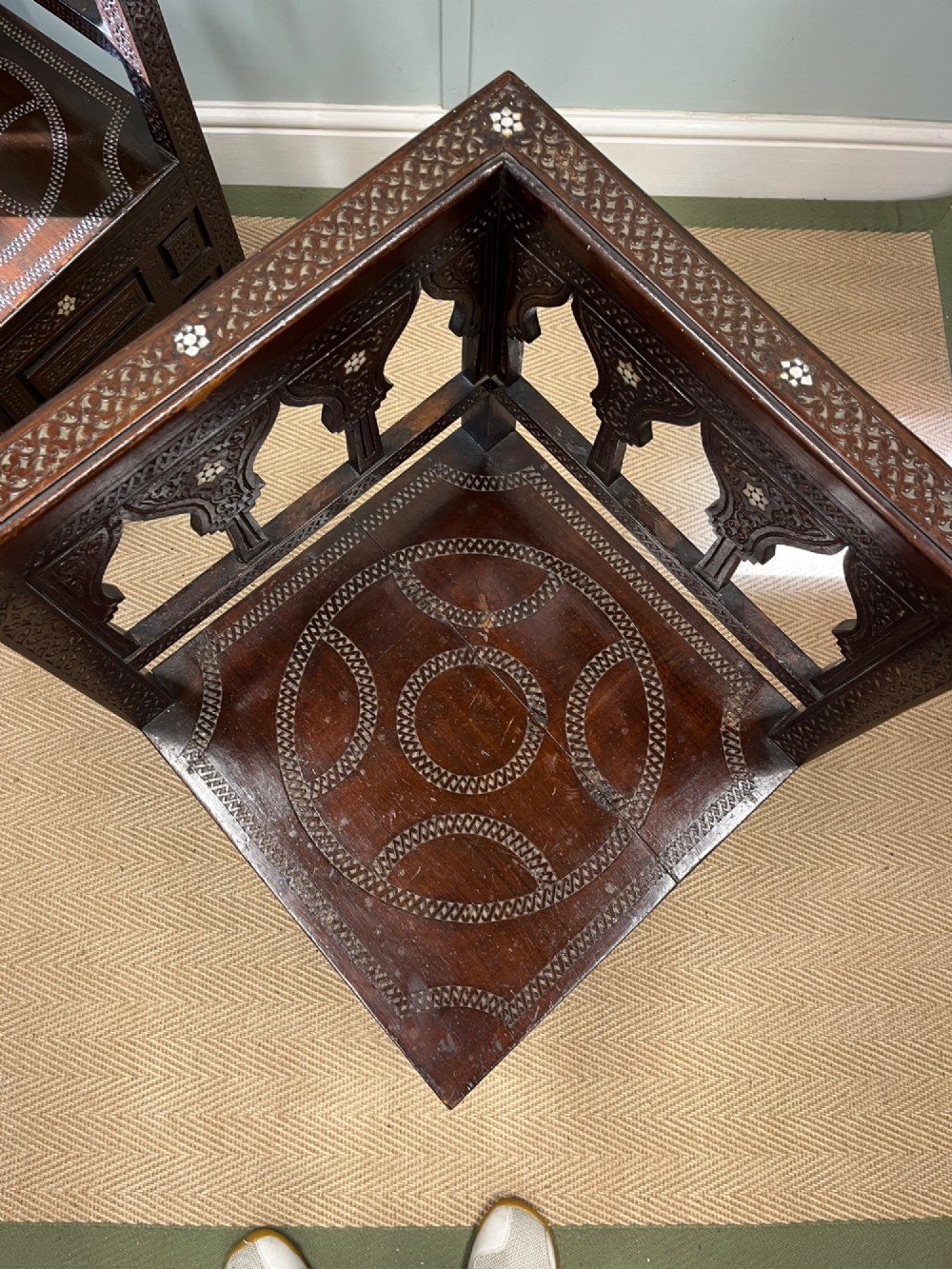 A pair of dark wood early 20th-century Moorish corner tables featuring geometric bone inlay and carved mashrabiya arch galleries. View IV
