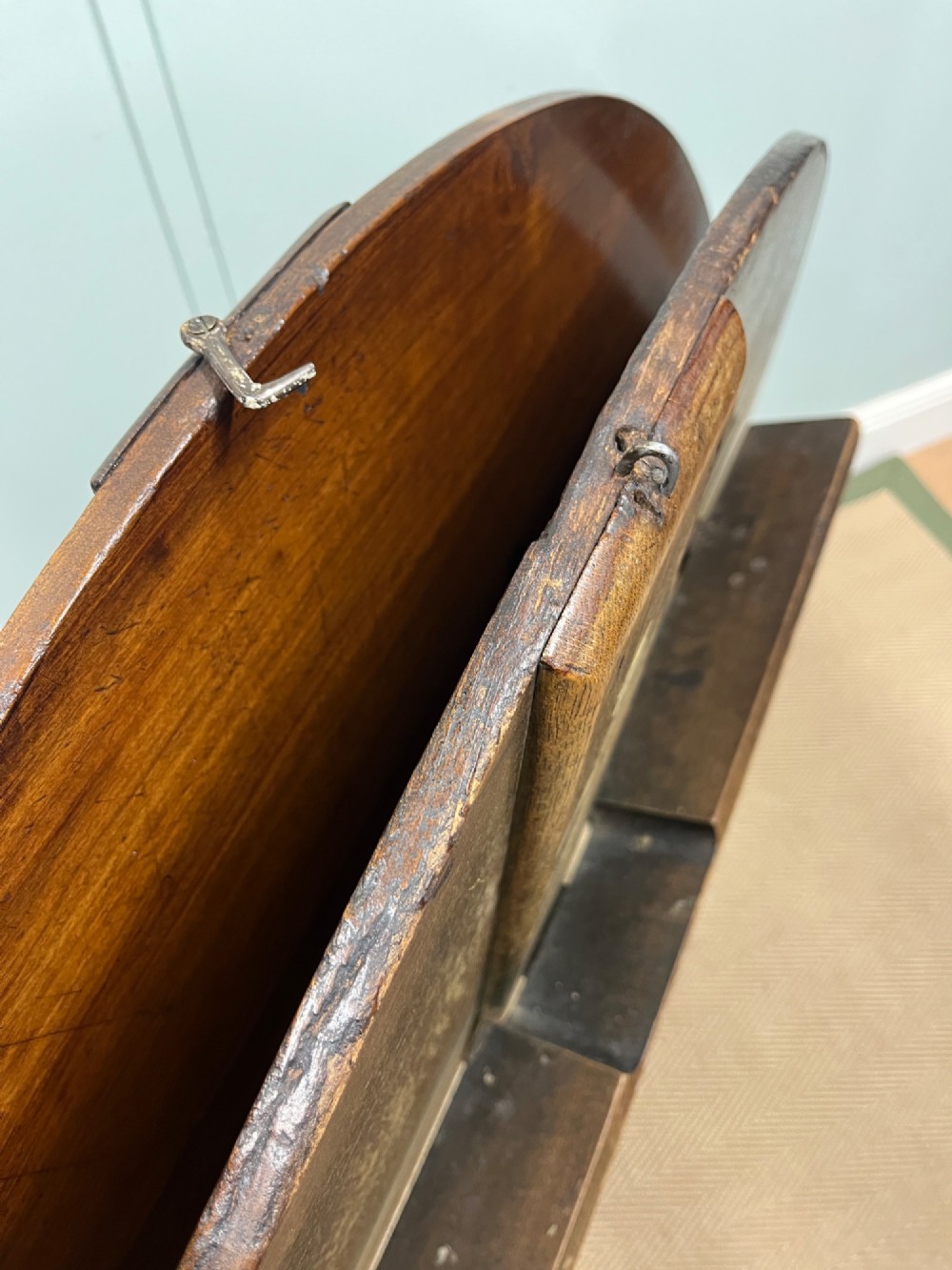 A circular 19th-century mahogany coaching table featuring a central hinged seam and brass hardware on turned legs. View VIII