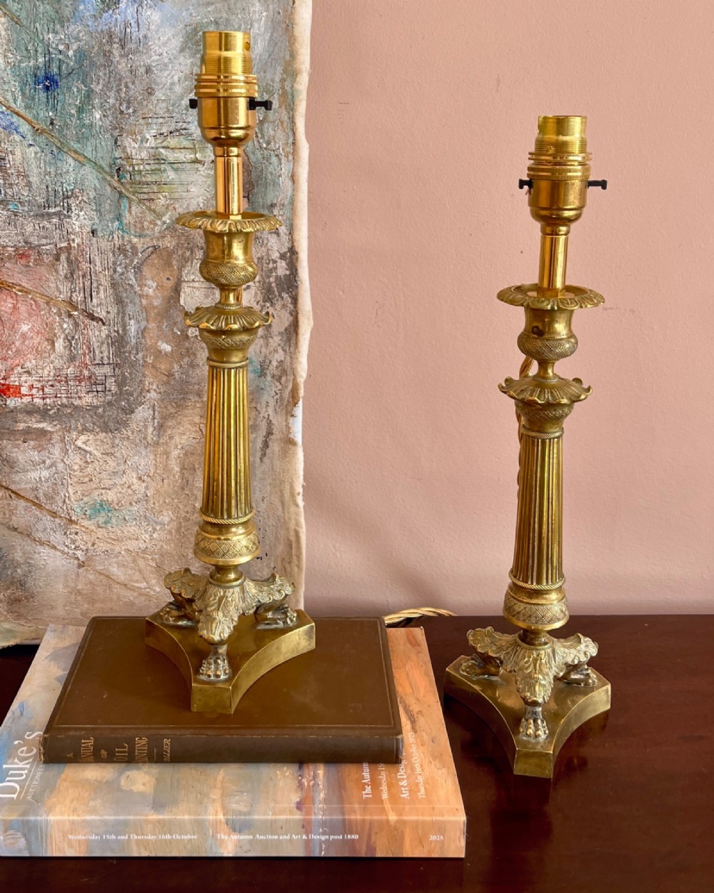 A pair of 19th-century fluted brass table lamps featuring claw feet bases and colourful pleated ikat fabric shades. View II