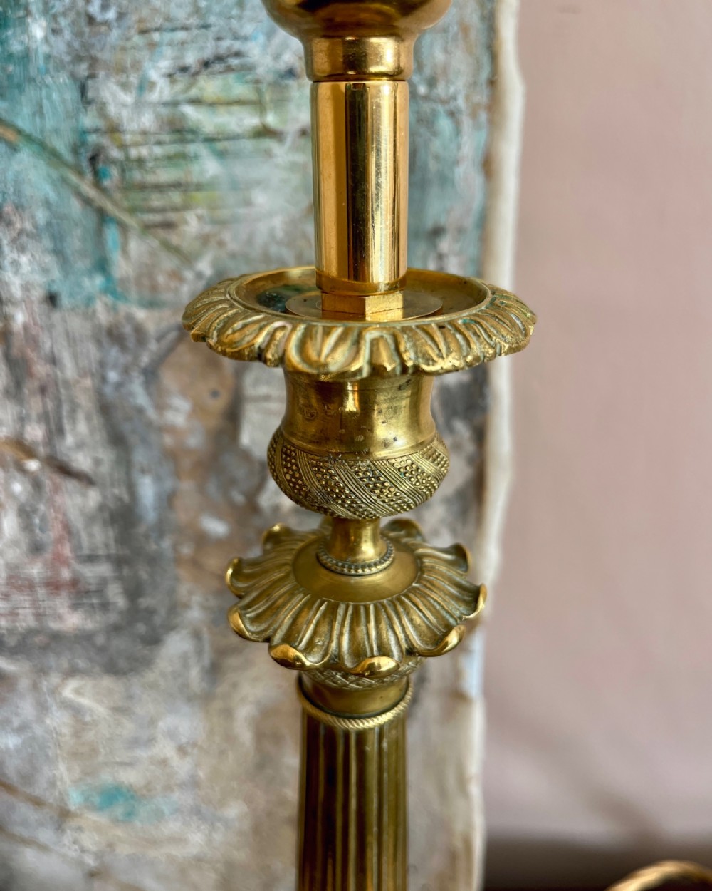 A pair of 19th-century fluted brass table lamps featuring claw feet bases and colourful pleated ikat fabric shades. View IV