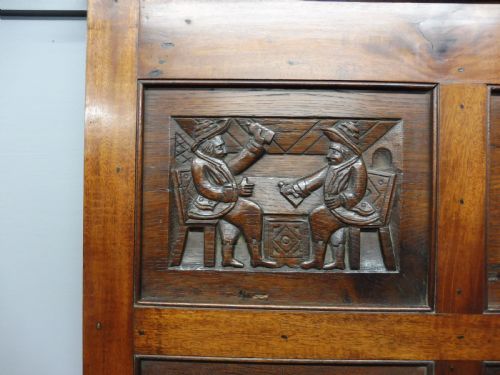 fig 1. CARVED STORY PANEL BY LOUIS WHITE   (THE ROAD TO RUIN)