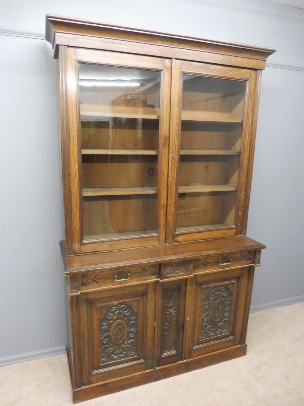 LARGE VICTORIAN CARVED OAK GLAZED BOOKCASE CIRCA 1890