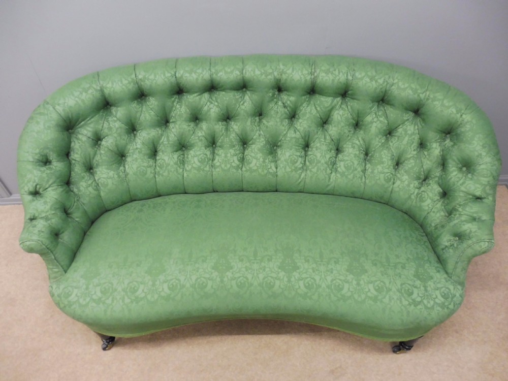 CHARMING CURVED VICTORIAN SOFA ON EBONISED LEGS CIRCA 1890  View V